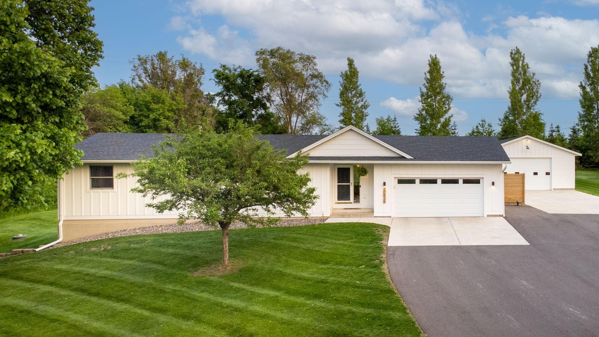 Newer asphalt & concrete, roof, siding, garage door, and privacy wood fence.