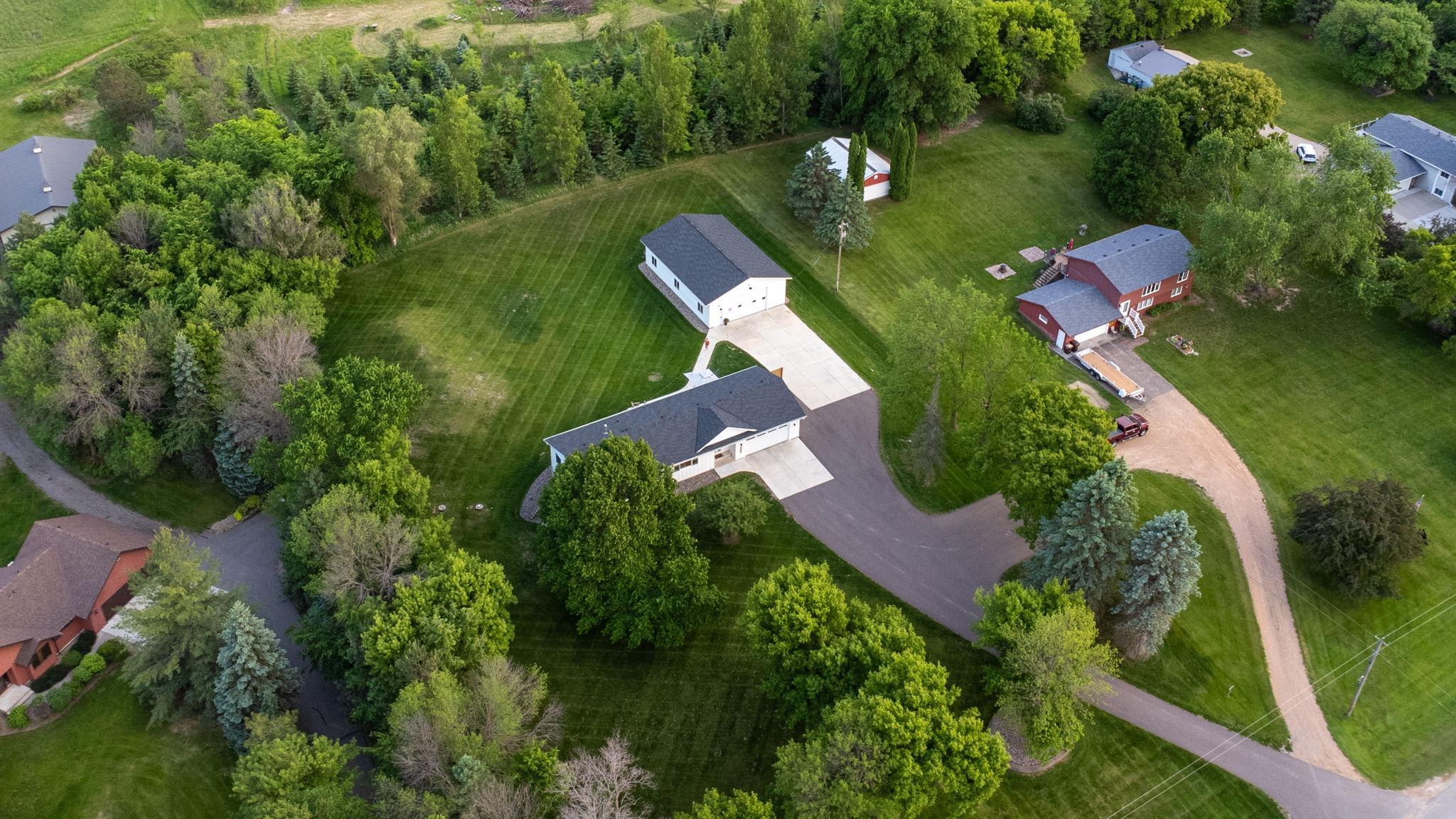 Asphalt driveway and concrete driveway and patios.
