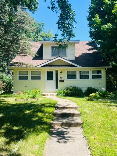 Sidewalk to front entrance leads you to the four season porch!