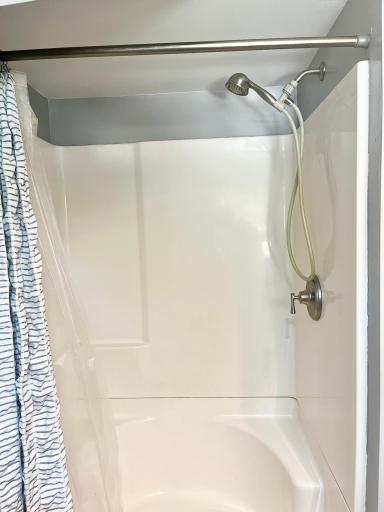 Updated shower stall w/ two corner seats built in