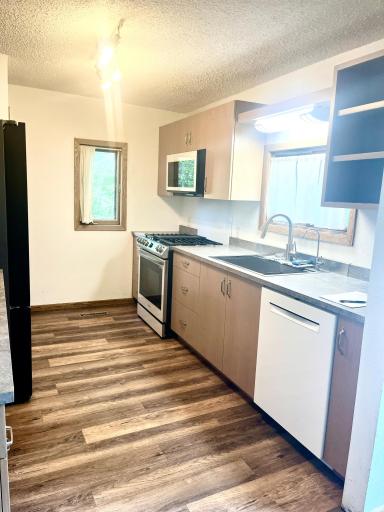 Lots of storage, counter space & natural & artificial light!