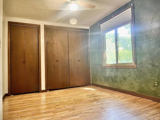 More original maple floors, great lighting, ceiling fan and double closets make this a great room where ample storage is needed.