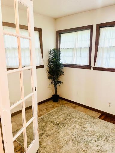 Four season porch can easily fit a small couch, lounge chairs, etc. Would make a great studio, work space, excersize room or green room with so much natural light.