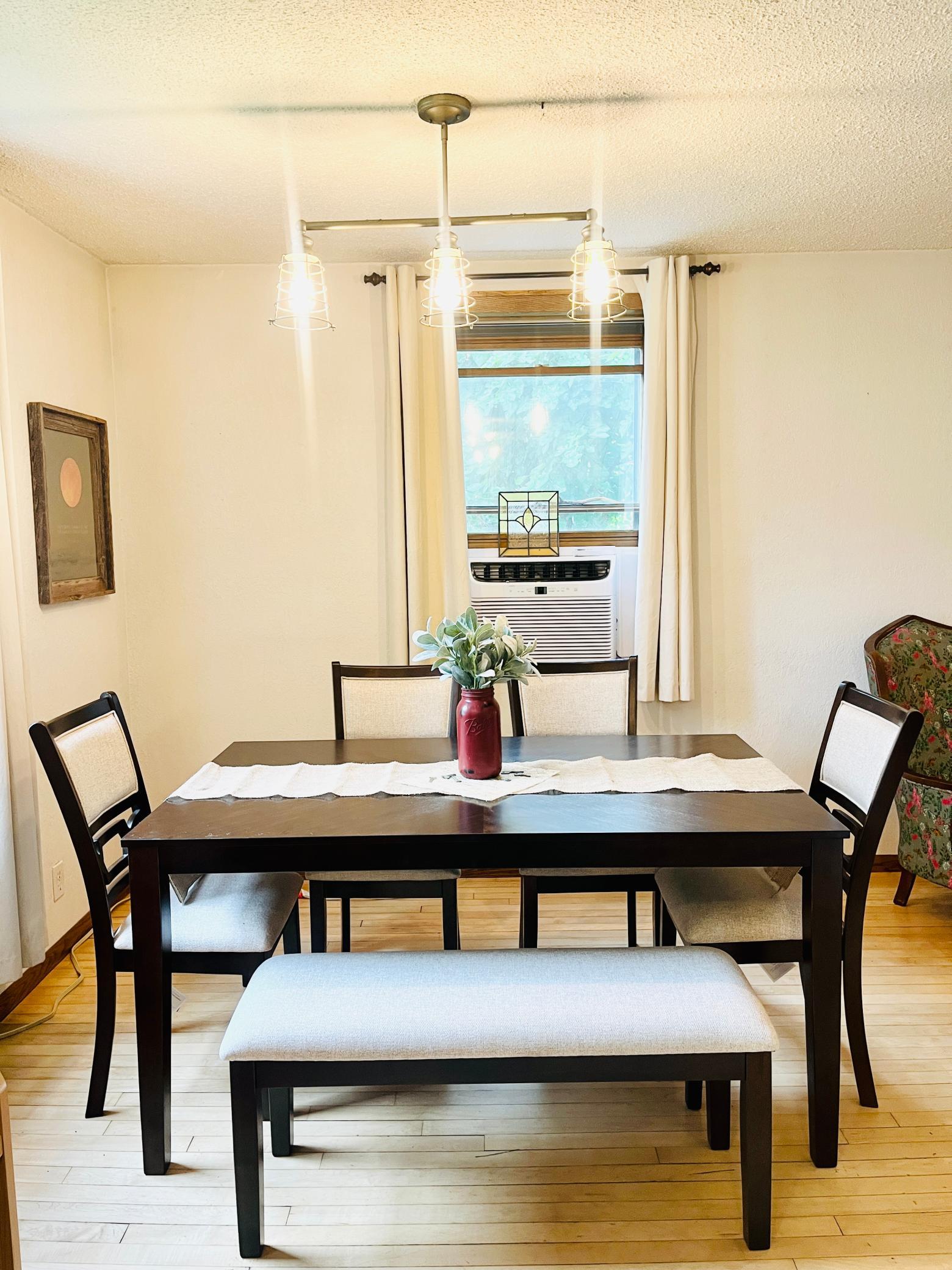 Dining Room is well lit & comes with an extra piece of stained glass that is original to the home!