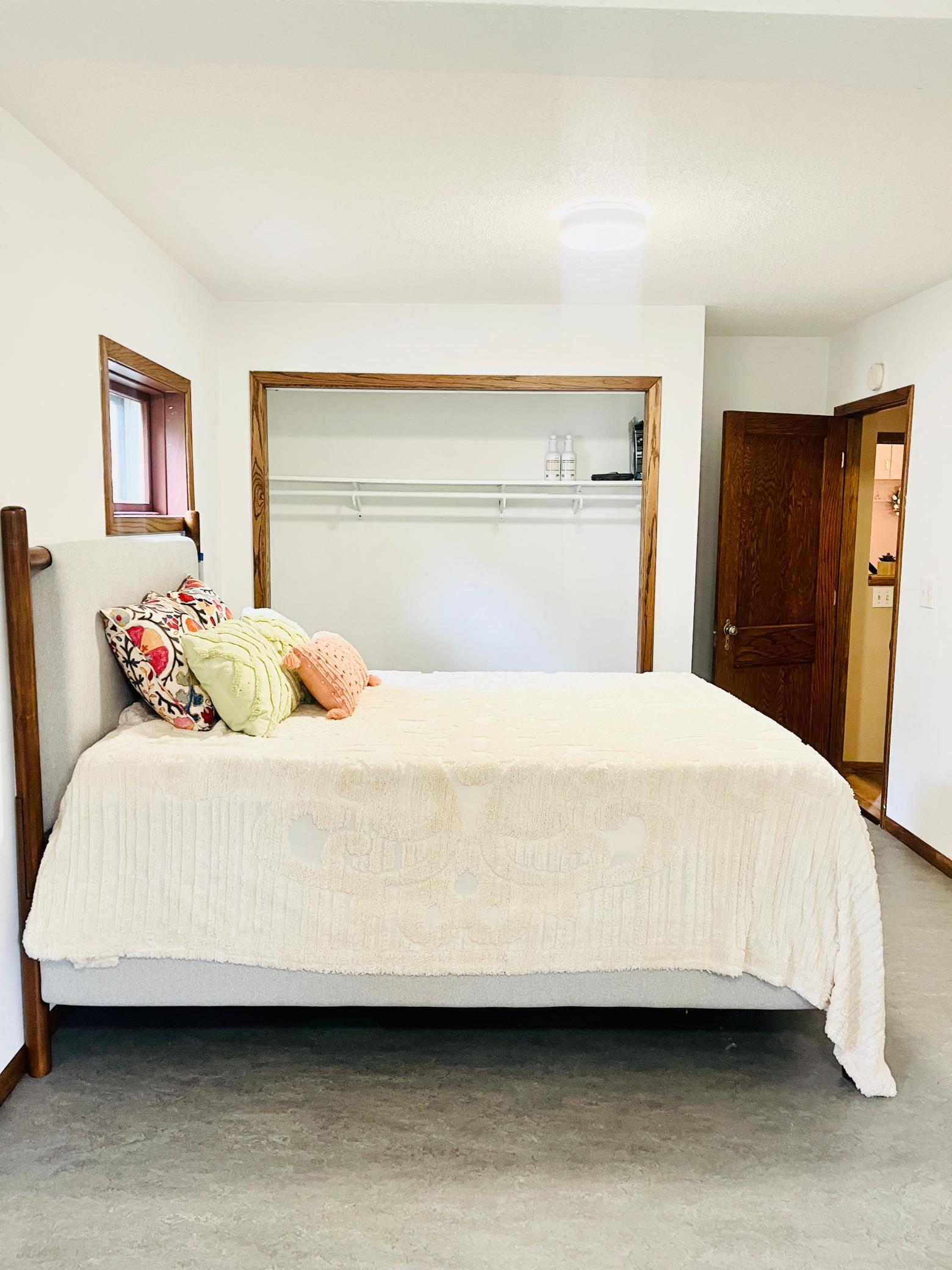 This room fits a Queen size bed well & offers a large closet!