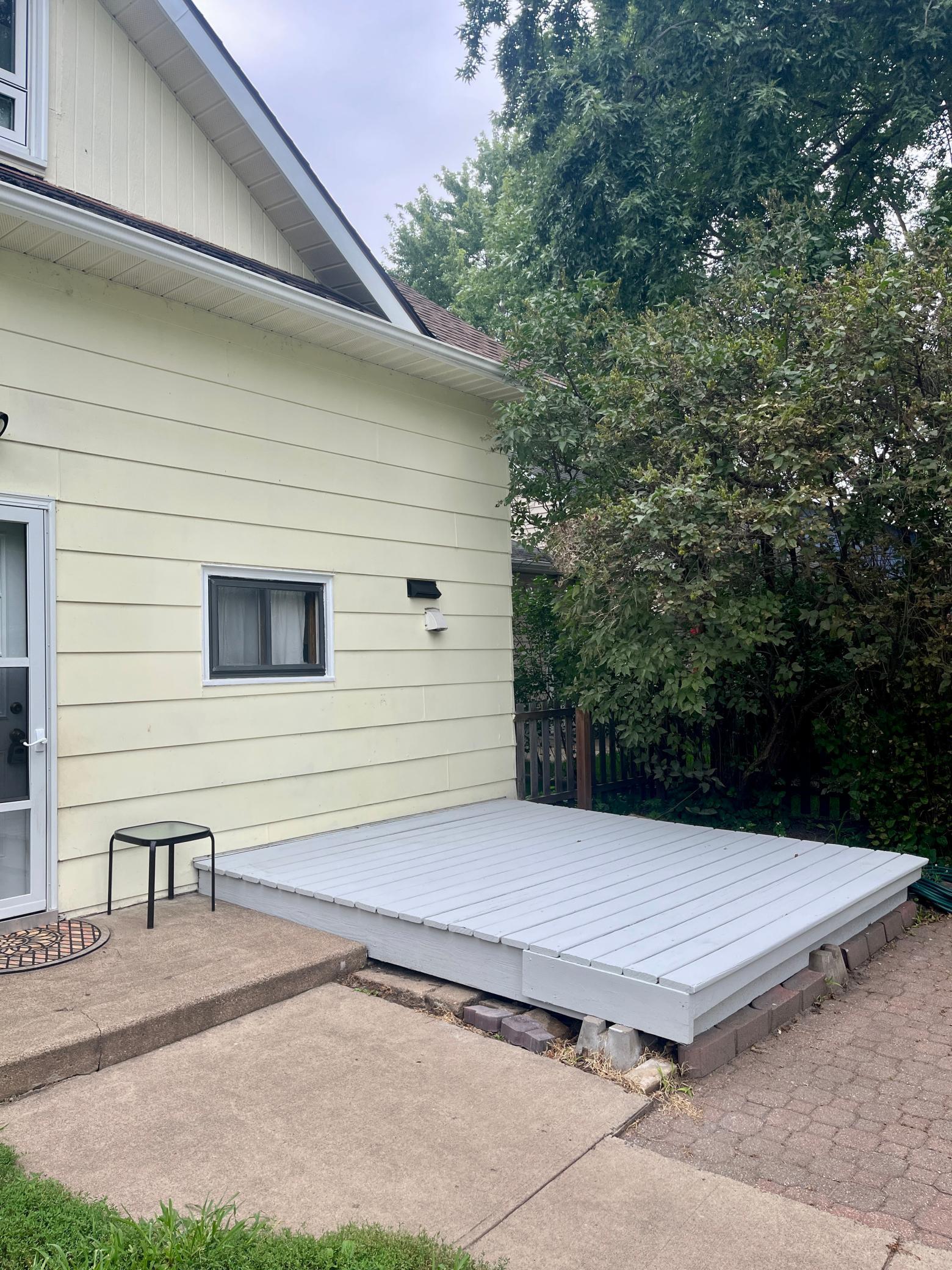 Just re-painted backyard porch is large enough for a table & 2-4 chairs. Seller was told it should last another 10 years! Automatic security lights, Lilacs offer privacy with arrivals and departures.