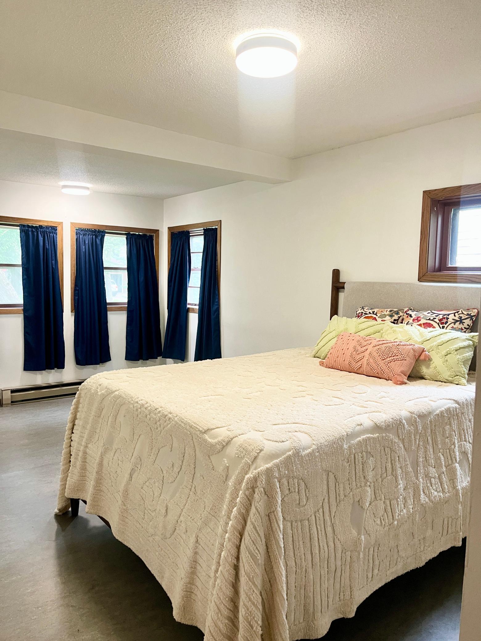Main floor bedroom is extra large with thoughtfully selected marmoleum flooring!