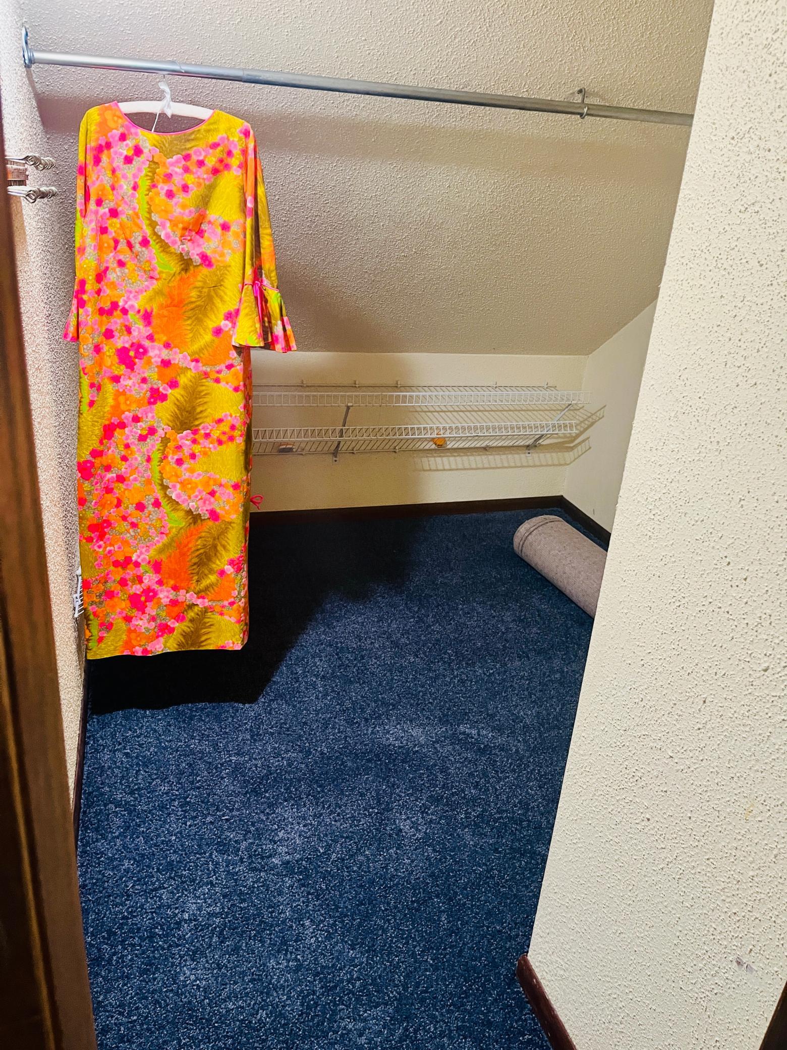 Bedroom walk-in closet (another rod behind this wall not pictured)
