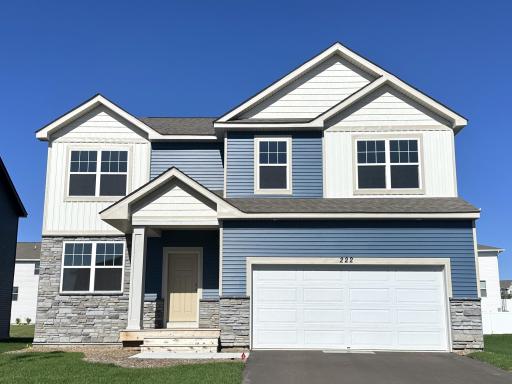 Welcome home to 222 Snowdrop! Beautiful curb appeal with landscaping, irrigation and sod already installed!