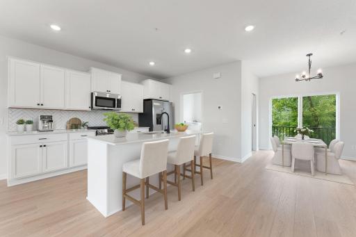 The Afton Kitchen Design is a chef's dream featuring a spacious center island prefect for cooking and entertaining with GA appliances and gas cooking