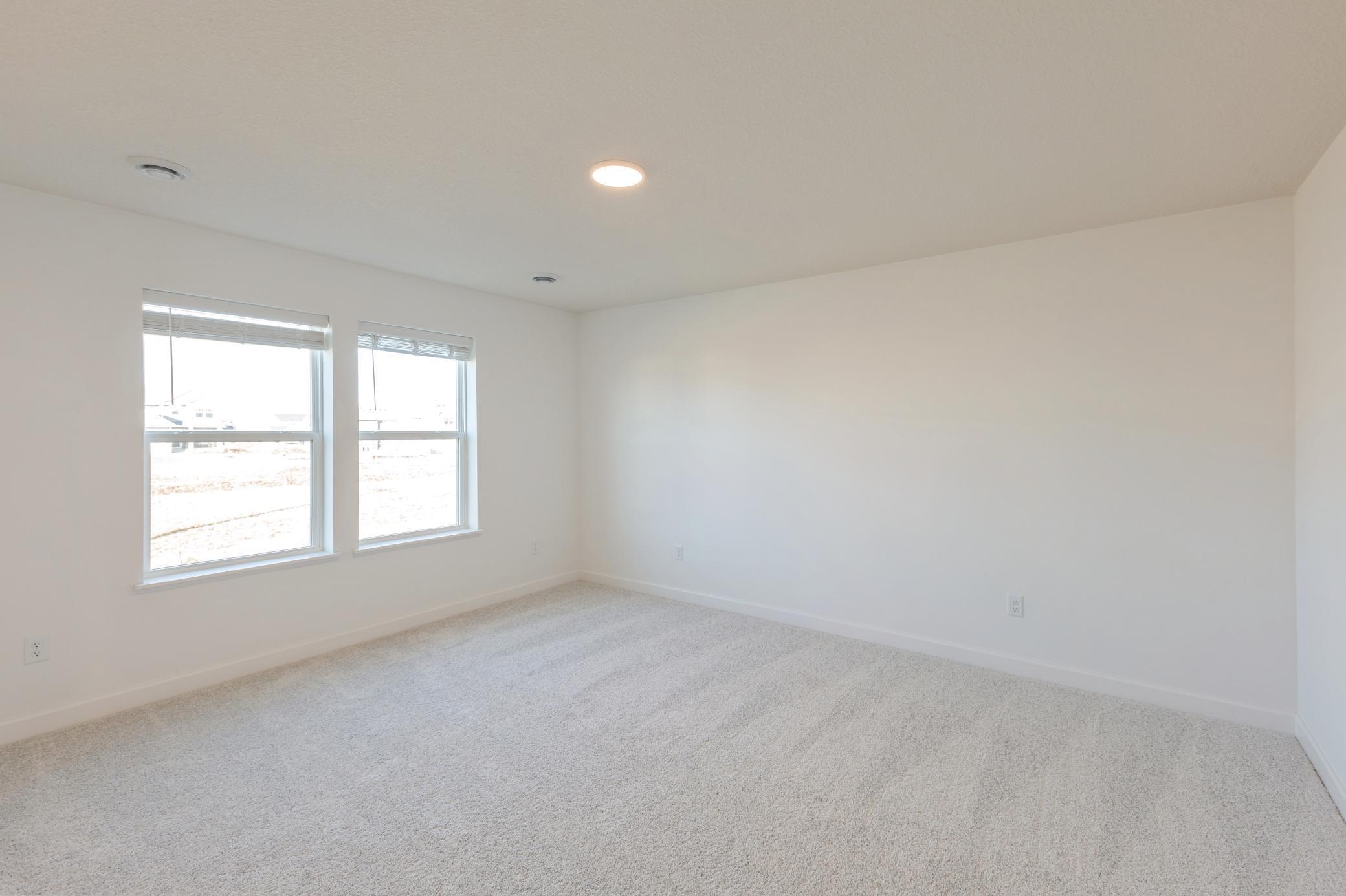 (*Photo of similar home, actual homes colors and finishes will vary) The primary bedroom is spacious and full of beautiful natural light from the large window