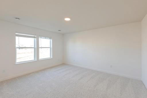 (*Photo of similar home, actual homes colors and finishes will vary) The primary bedroom is spacious and full of beautiful natural light from the large window