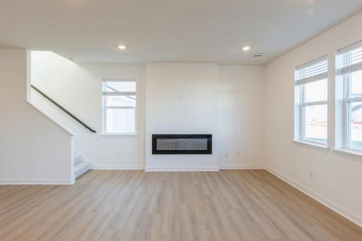 (*Photo of similar home, actual homes colors and finishes will vary) The Great Room has a cozy fireplace as a beautiful focal point to the space