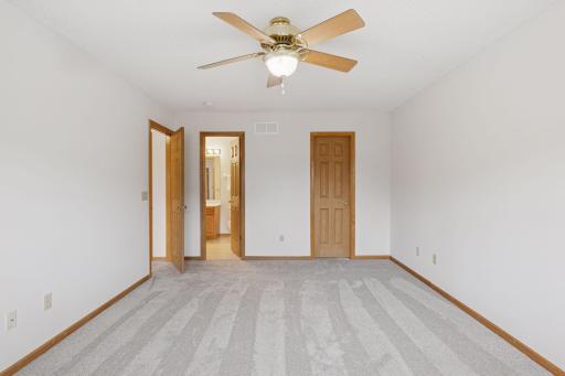 "Owner's" bedroom offers a walk-though to the full bath.