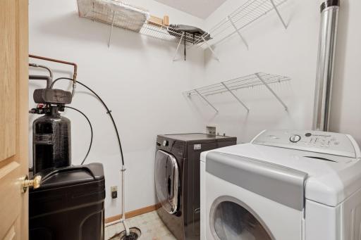 Main level laundry/utility room. Water softener. Washer 10/2022 and dryer to stay with the property. Water heater 12/2023.