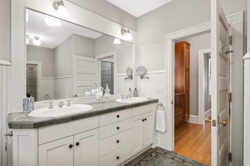 Ensuite bathroom with gorgeous blue-green tiles & a custom double vanity.