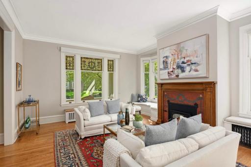 Note the torch featured in both the fireplace surround and the stained-glass window. The hand-held torch has long been the symbol of freedom and liberty.