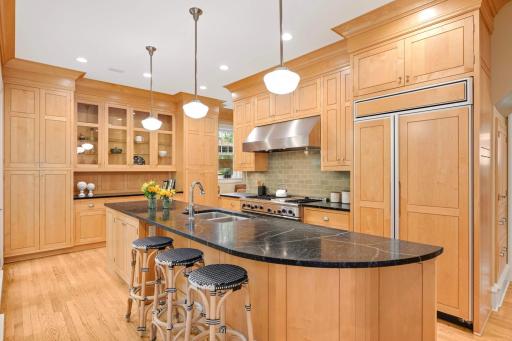 The center island offers plenty of space for friends and family to hang out with the chef.