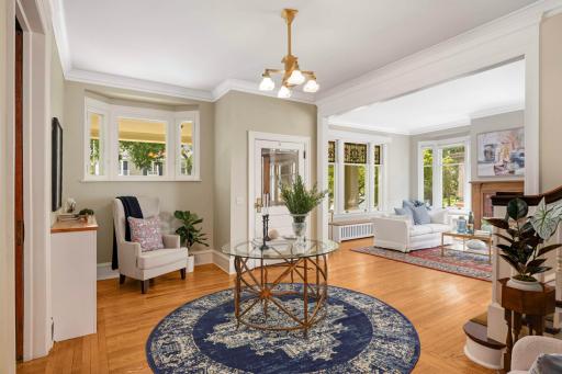 Exquisite architectural details include enameled woodwork, diamond-paned, leaded & stained glass windows.