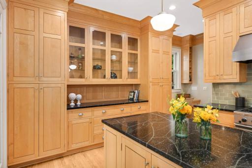 Floor-to-ceiling inset cabinetry with gorgeous soap stone countertops.