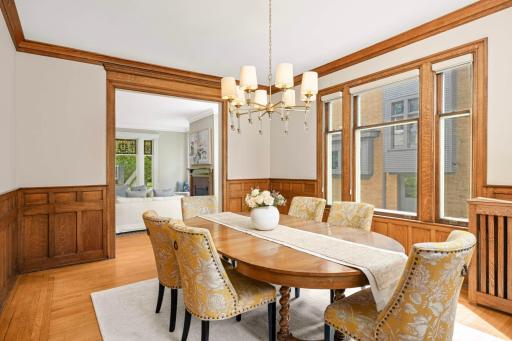 Adjoining the living room is a formal dining room featuring a stunning buffet.