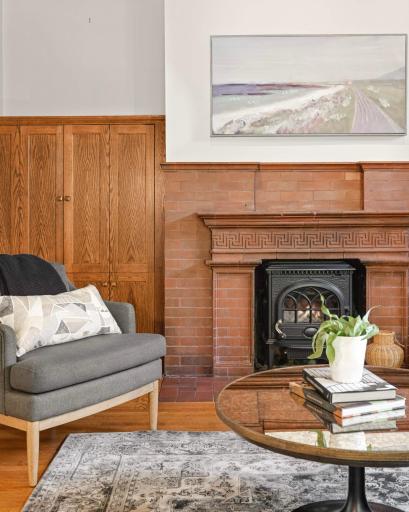 Original brick surround updated with a gas stove insert.