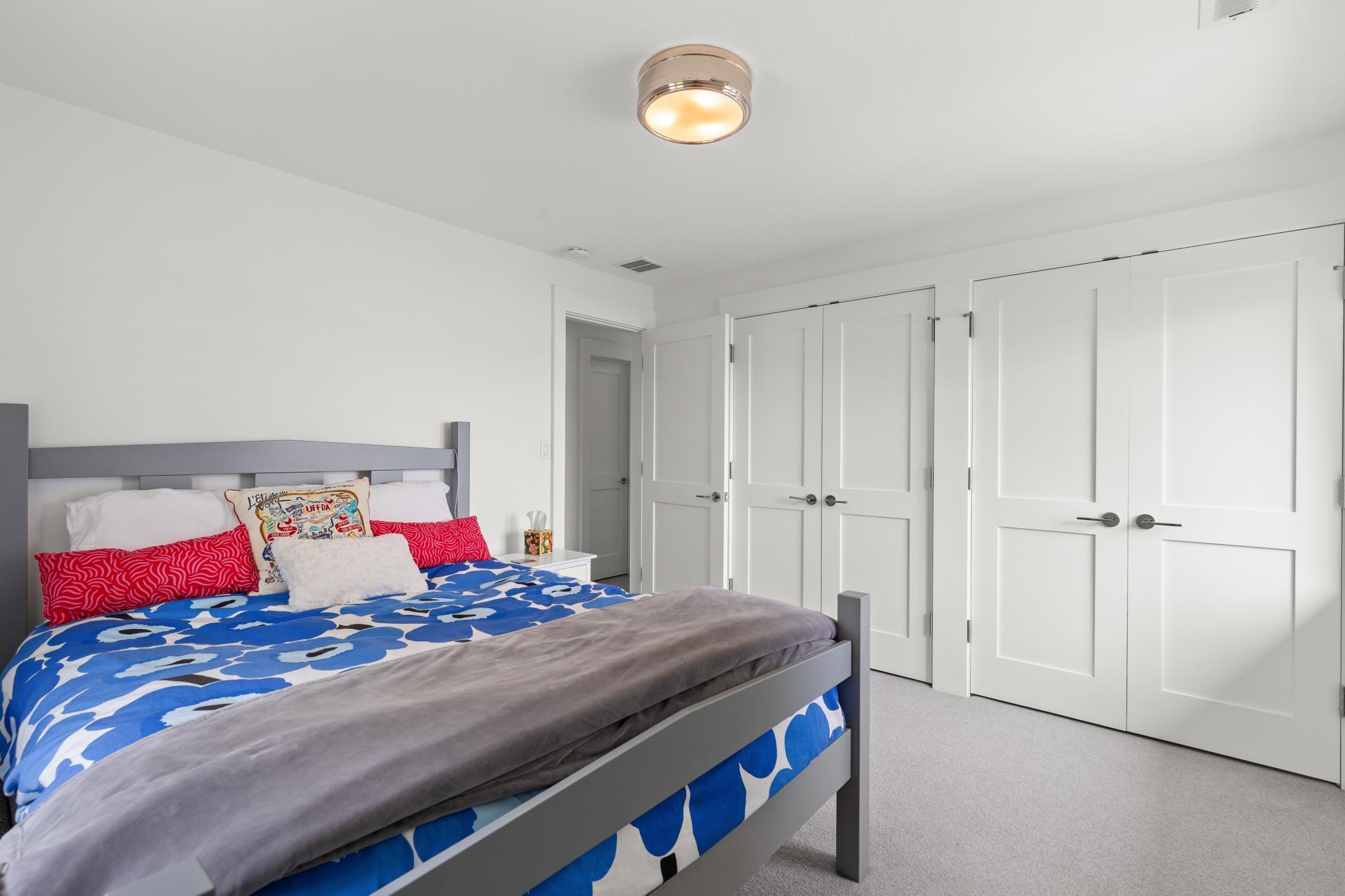 Bedroom on the second level with generous walk-in closets.
