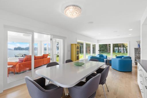 Defining an open floor plan, this dining room flows into the living room and sun room.