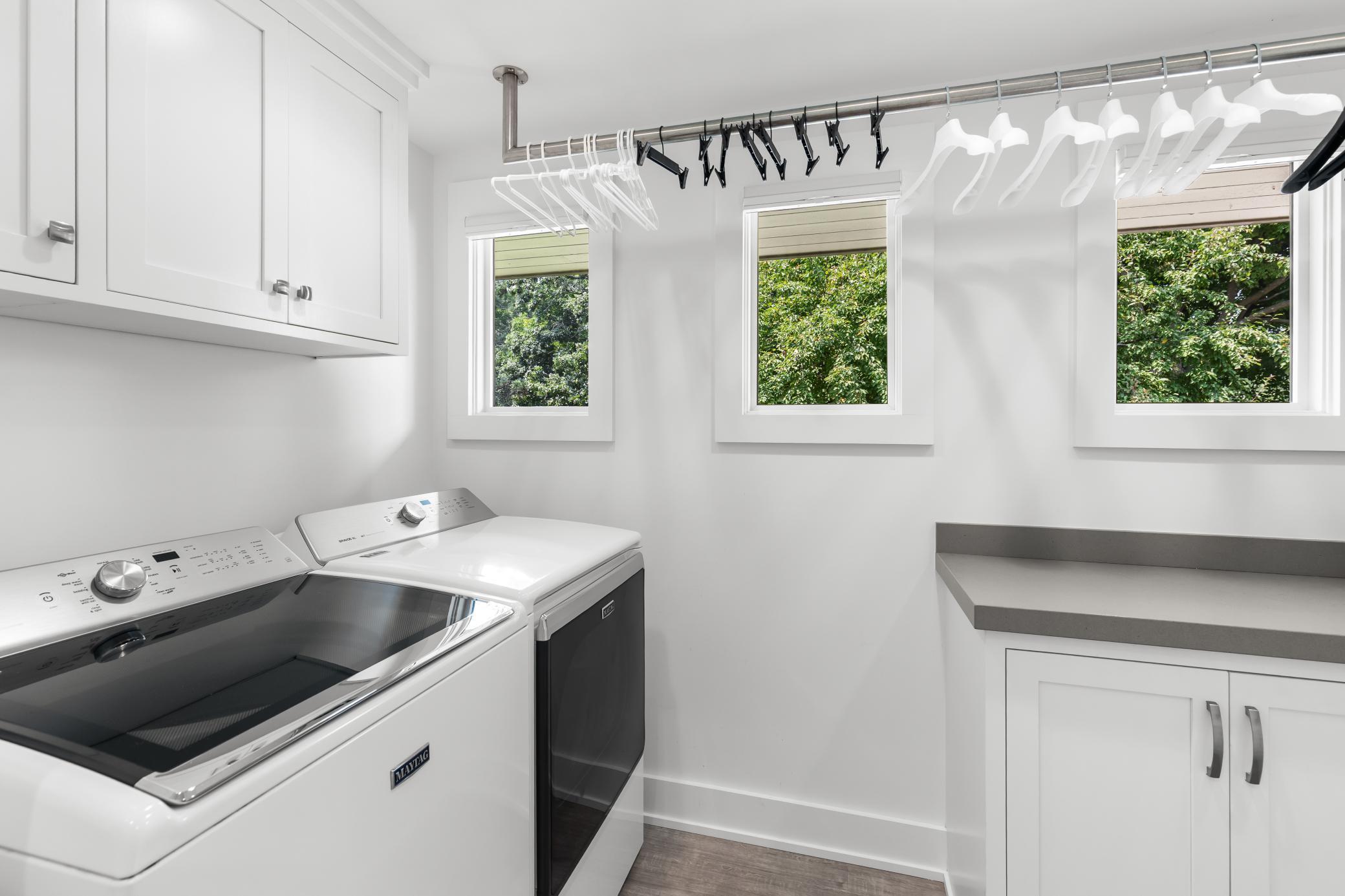 Main floor laundry conveniently located near the primary bedroom.