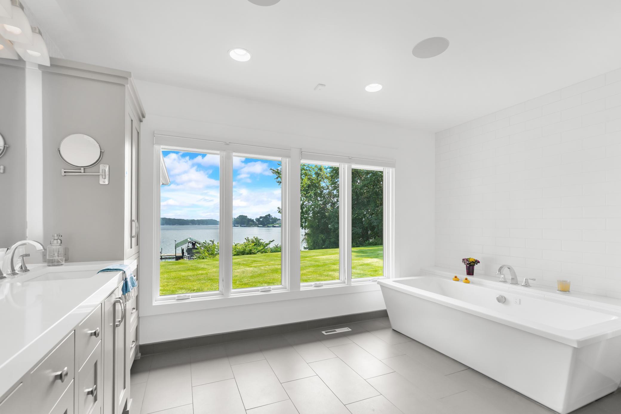 A soaking tub and of course floor to ceiling views from the primary bathroom.