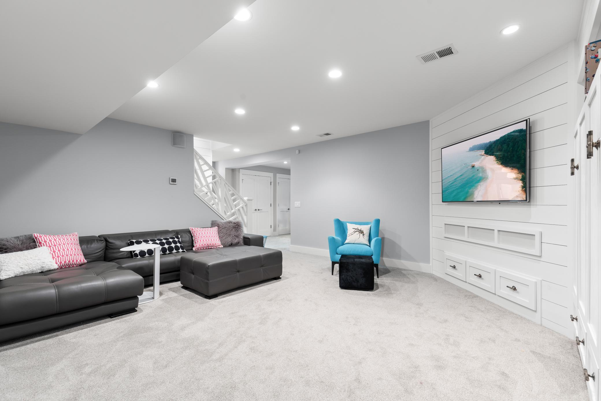 Lower level is carpeted and spacious. [Includes media area, flex space, and possible 6th bedroom].