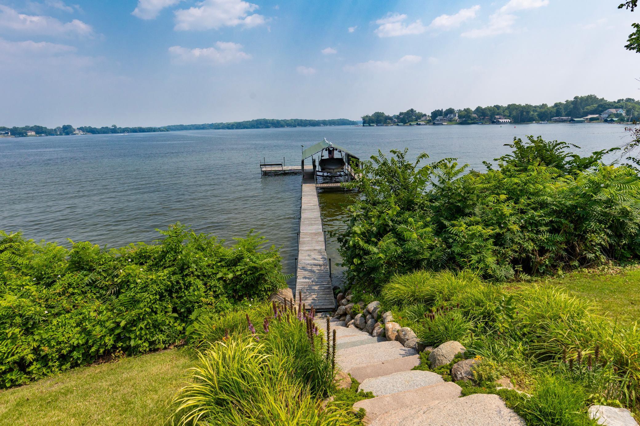 A few steps down on your private dock to swimming and boating in this "A-rated" sandy bottom shoreline.