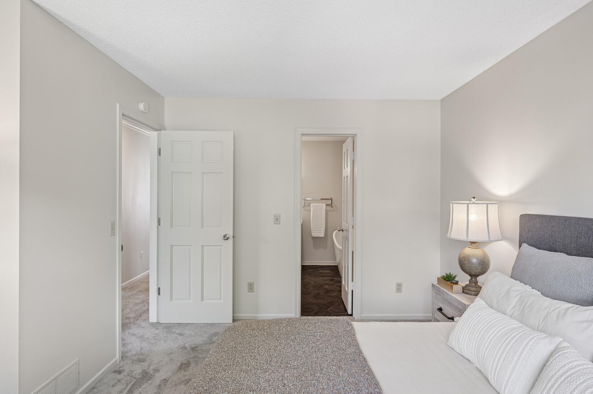 Primary bedroom with a walk-through door to the bathroom.
