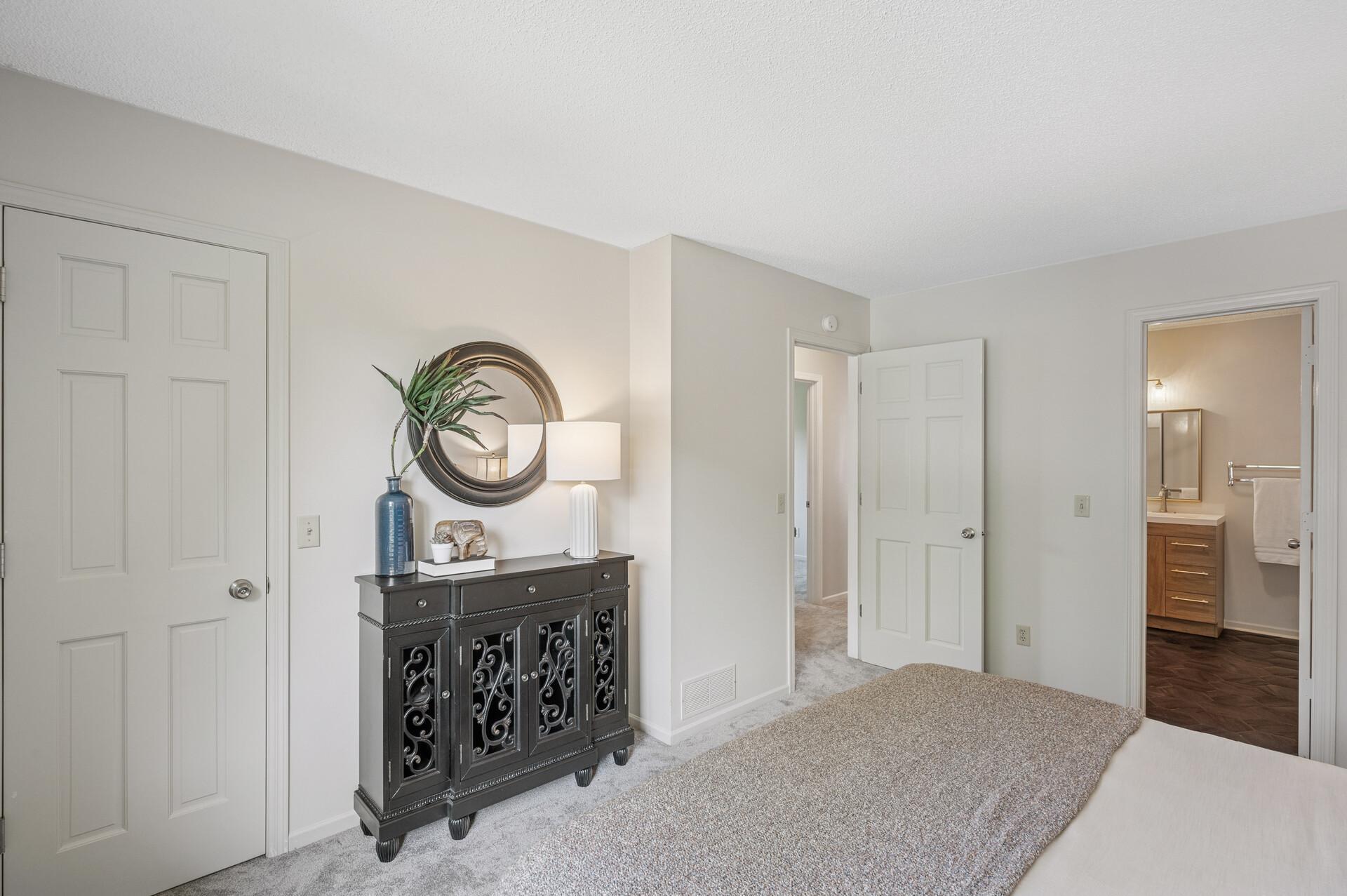 Primary bedroom with a walk-in closet.