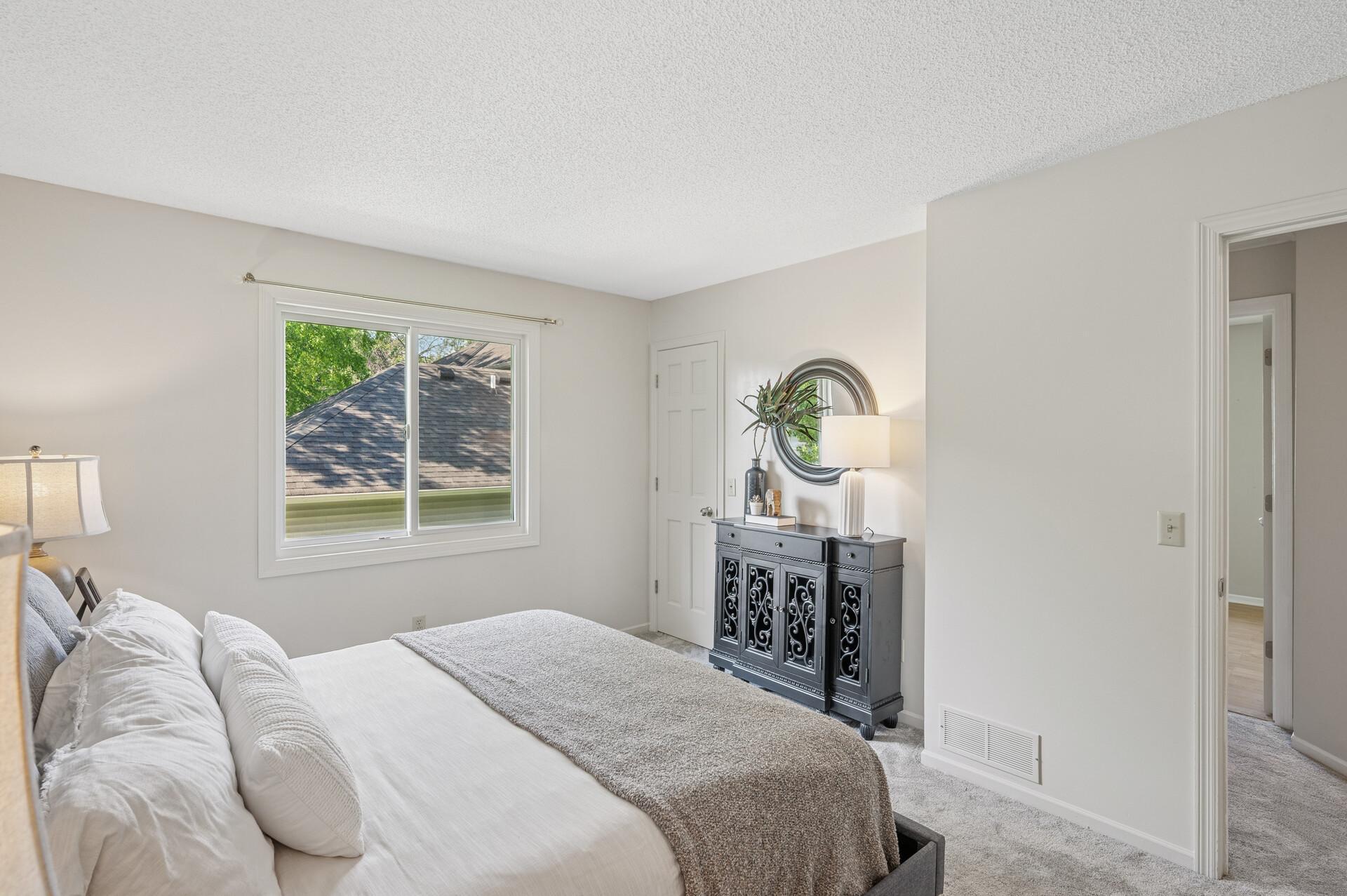 Primary bedroom with a walk-in closet.