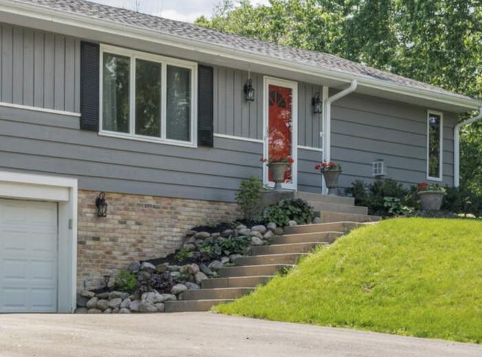 There is no denying the curb appeal of this lovely home The expansive yard features mature trees and perennials.