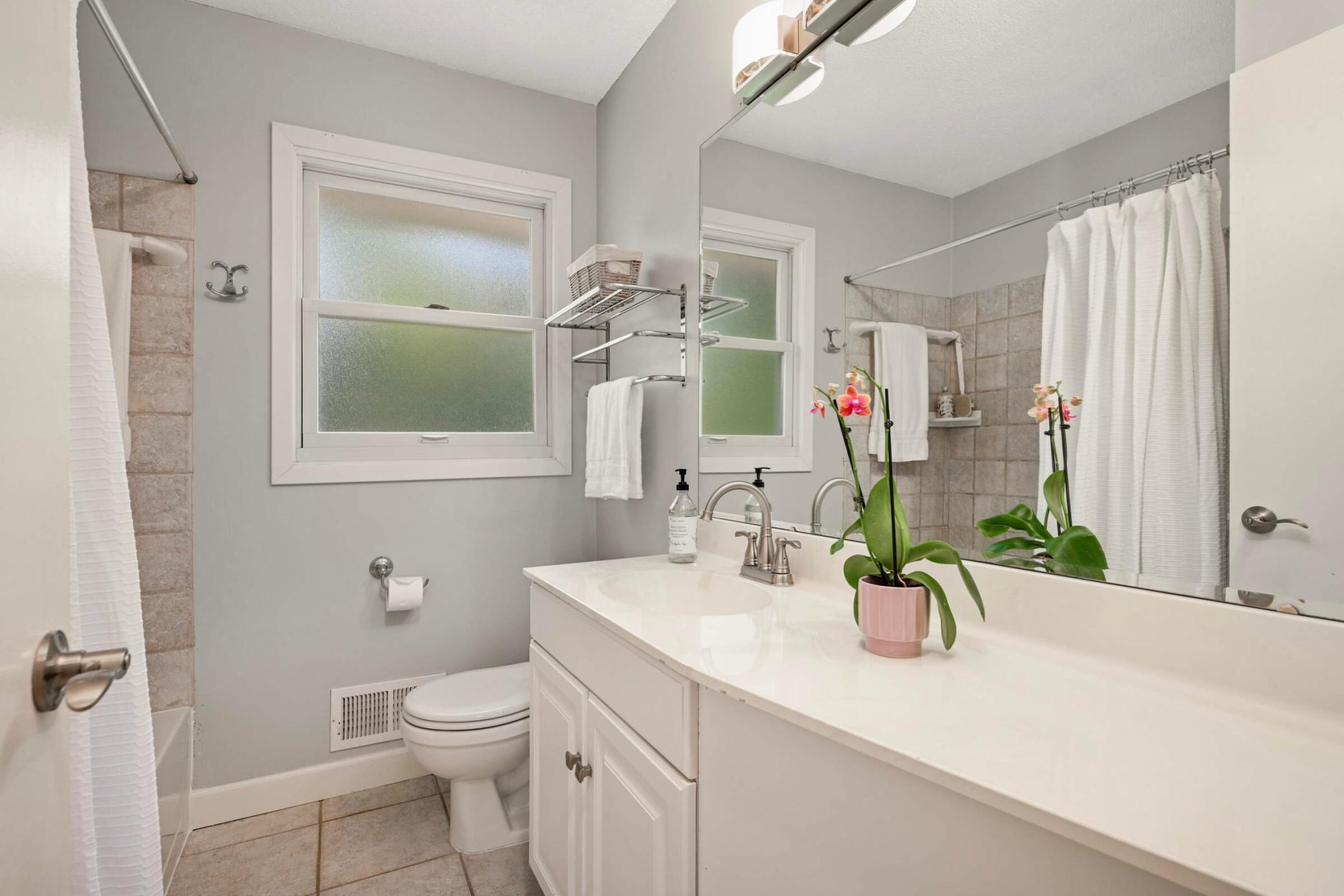 2nd full bathroom on the main level with large vanity.