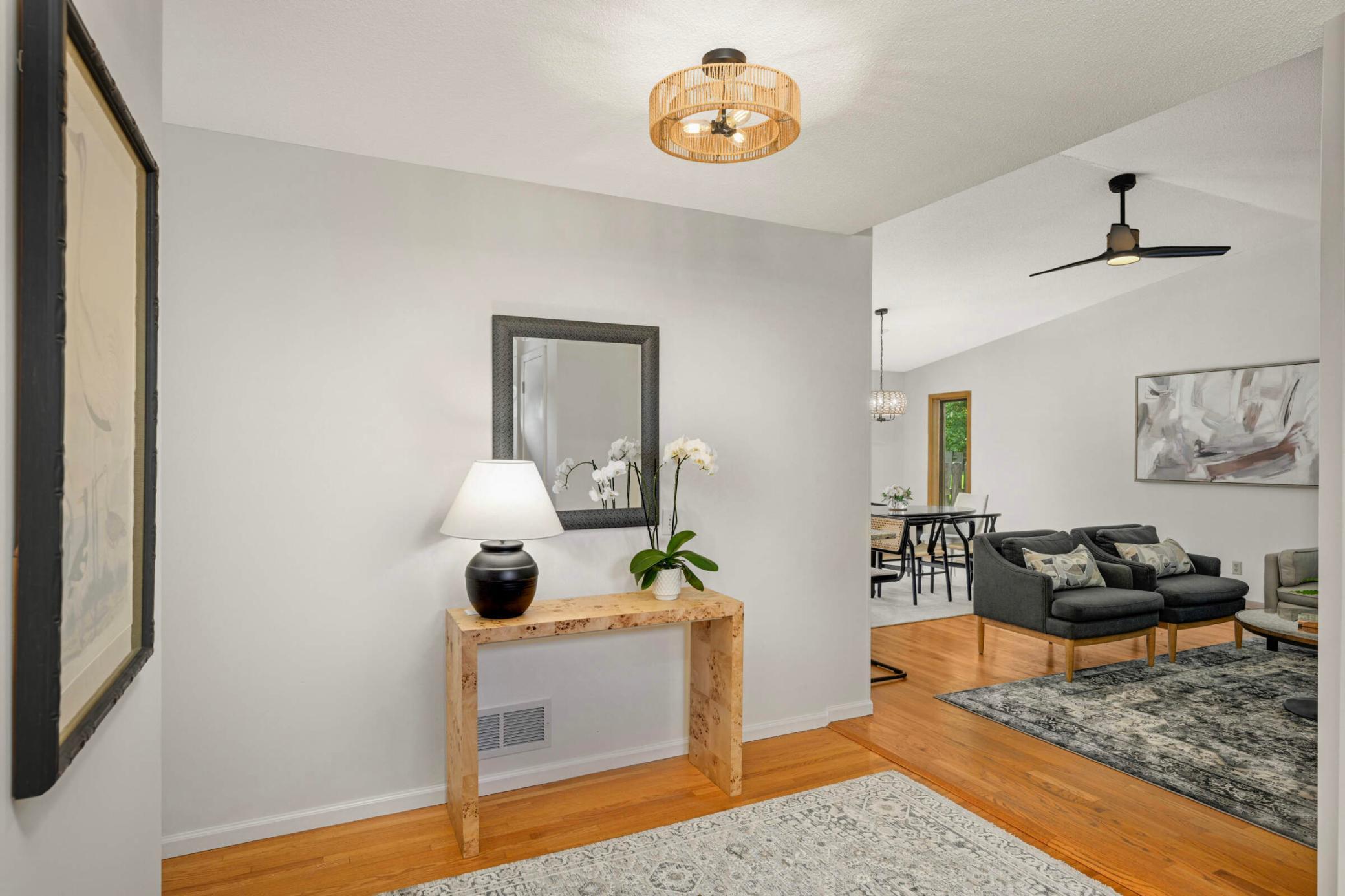 From the entry, you can already appreciate the soaring vaulted ceilings and beautiful new lighted ceiling fan. .