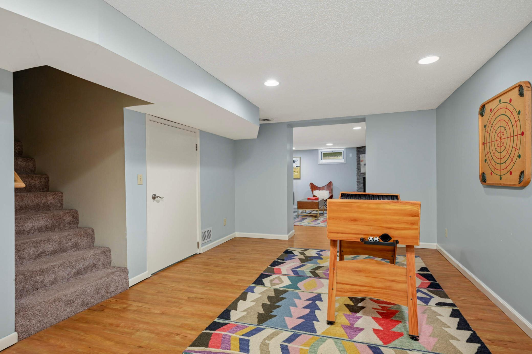 Versatile lower-level flex space right off the garage offers immediate access to the lower level bathroom and the large laundry room.