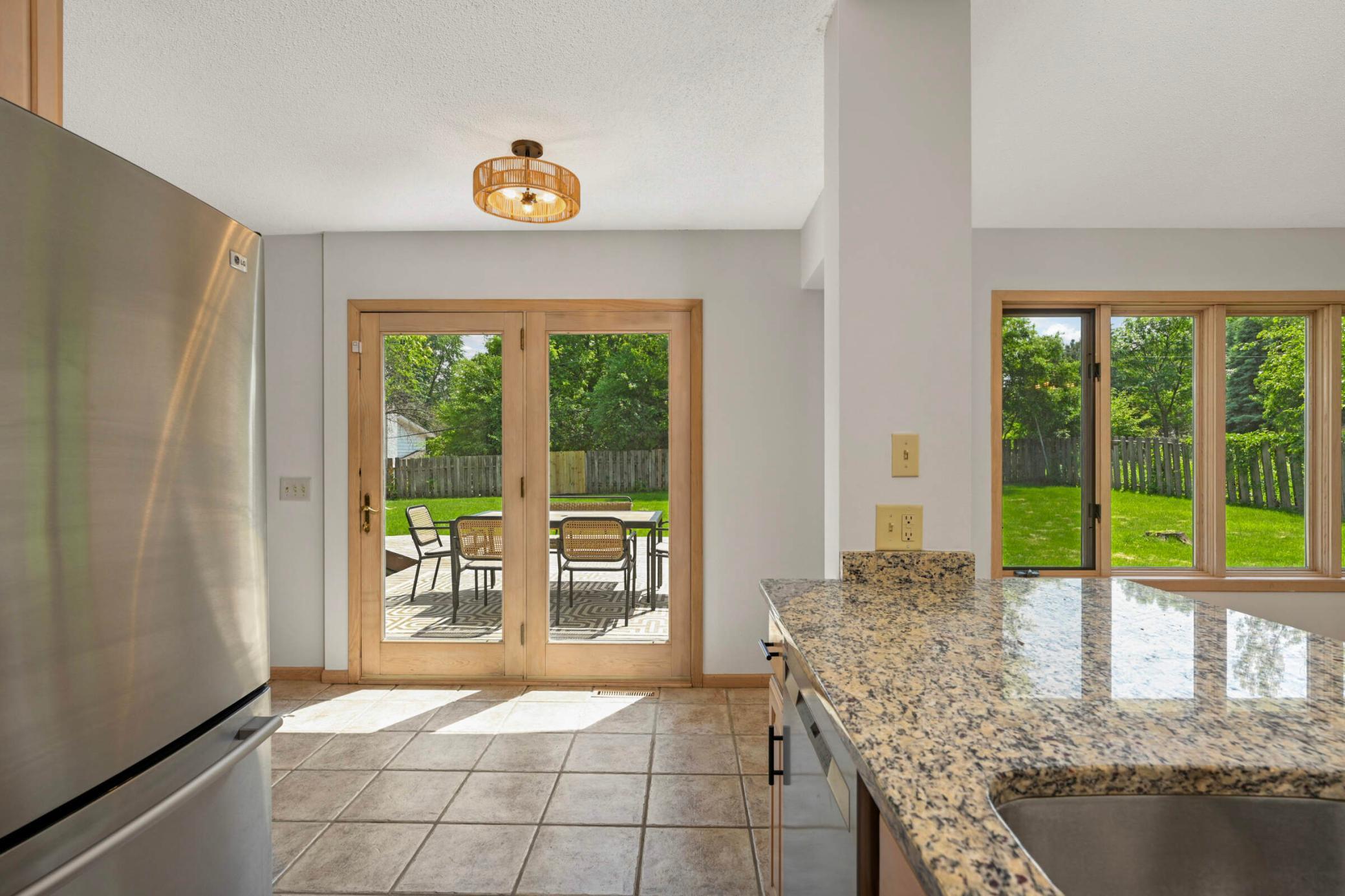 The large deck off of the kitchen is perfect for entertaining, grilling and outdoor dining.
