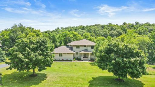 Welcome home to this private Northwoods retreat on over 7 acres!