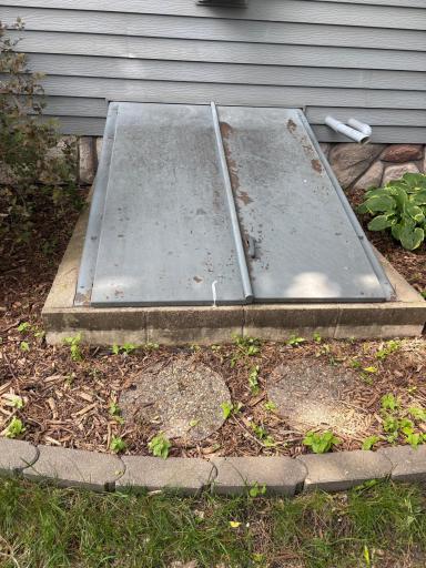 Trap door leading to crawl space under the new addition