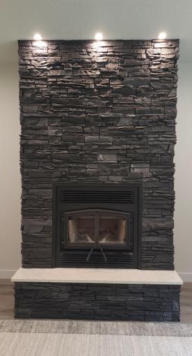 Wood burning fireplace is a beautiful focal point in the living room