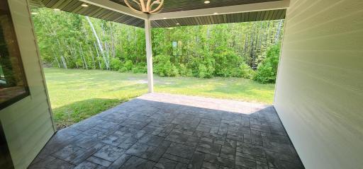 Enjoy the stamped covered concrete patio and sidewalks
