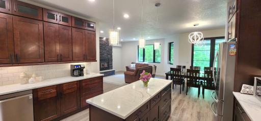 View of dining area and living room from the kitchen