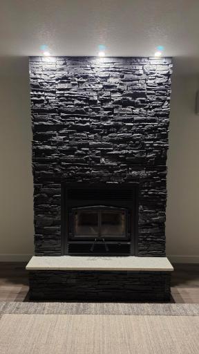 Recessed lighting above the fireplace