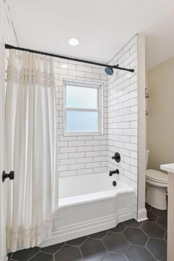 Renovated and expanded full bathroom on the main floor