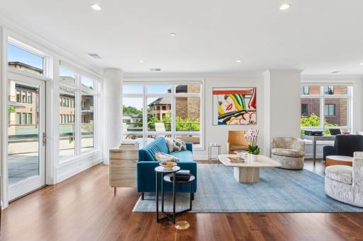 This corner unit boasts expansive windows that flood the space with an abundance of natural light