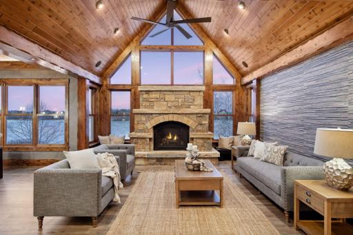 Masterfully crafted with hand hewn timbers and gas fireplace with stone hearth and surround.
Built-in window benches offer additional seating.
