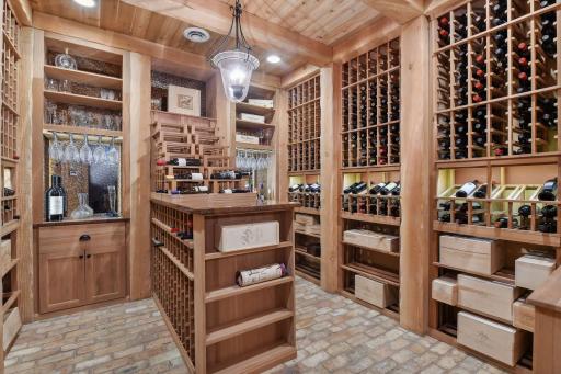 Climate controlled Wine cellar with brick floors and an extensive 500+ bottle wine rack